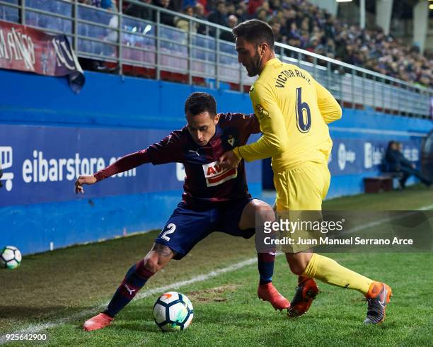Fabian Orellana of SD Eibar duels for the ball with Victor Ruiz of Villarreal CF during the La Liga match between SD Eibar and Villarreal CF at...