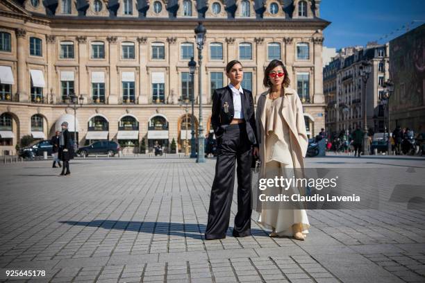 Camila Coelho and Aimee Song, are seen in the streets of Paris before the Lanvin show during Paris Fashion Week Womenswear Fall/Winter 2018/2019 on...