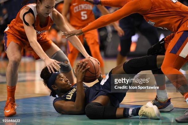 Georgia Tech Yellow Jackets guard Chanin Scott grabs the ball on the floor during the ACC women's tournament game between the Clemson Tigers and...