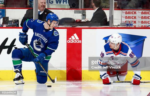 Nikolay Goldobin of the Vancouver Canucks talks to Pavel Buchnevich of the New York Rangers during their NHL game at Rogers Arena February 28, 2018...