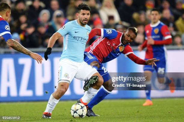 Sergio Aguero of Manchester City and Geoffroy Serey Die of Basel battle for the ball during the UEFA Champions League Round of 16 First Leg match...