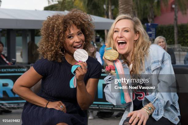 Tanika Ray and Jamie Anderson pose together at "Extra" at Universal Studios Hollywood on February 28, 2018 in Universal City, California.