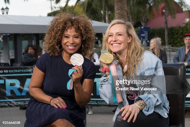 Tanika Ray and Jamie Anderson pose together at "Extra" at Universal Studios Hollywood on February 28, 2018 in Universal City, California.