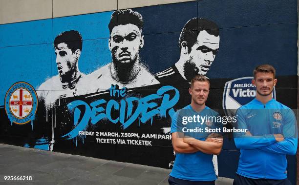 Scott Jamieson and Dario Vidosic of City pose in front of a street art installation during a Melbourne City FC A-League media opportunity at...