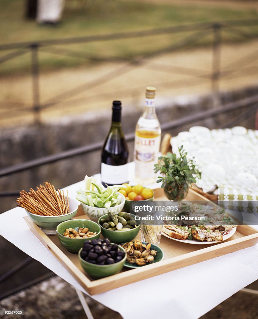 Appetizers and beverages on outdoor table