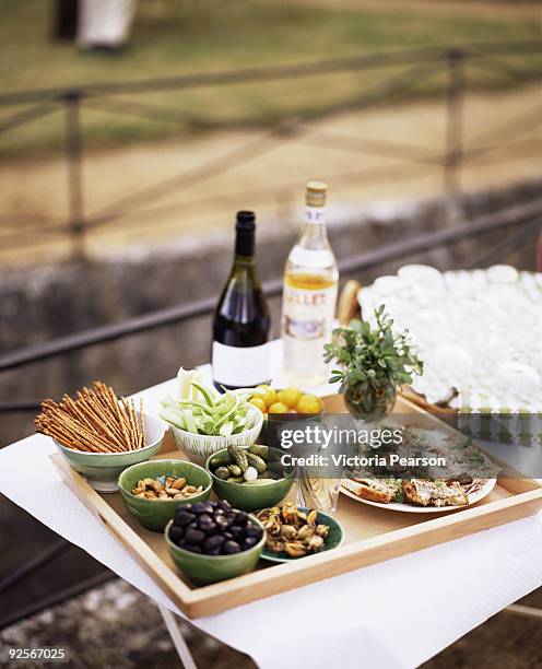 appetizers and beverages on outdoor table - aperitif stockfoto's en -beelden