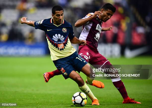 America's Cecilio Dominguez of Mexico vies for the ball with Saprissa's Johan Venegas of Costa Rica, during the second leg CONCACAF Champions League...