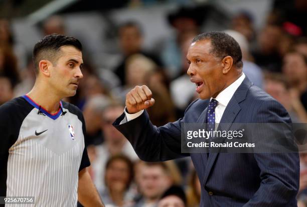 Head coach Alvin Gentry of the New Orleans Pelicans talks with official Zach Zarba during a game against the San Antonio Spurs at AT&T Center on...