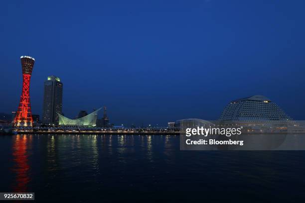 The Kobe Tower, left, the Hotel Okura Kobe, second left, the Kobe Maritime Museum, third left, and the Oriental Hotel, right, stand illuminated at...