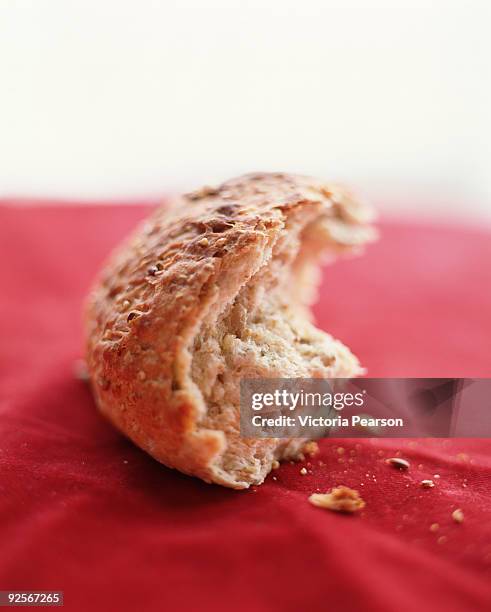 half eaten multi-grain dinner roll - breadcrumb stock pictures, royalty-free photos & images