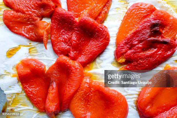 red peppers cooked on tray - roasted pepper stock pictures, royalty-free photos & images