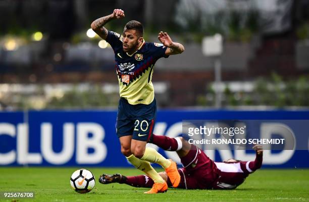 America's french Jeremy Menez of Mexico vies for the ball with Michael Barrantes of Saprissa from Costa Rica, during the second leg CONCACAF...