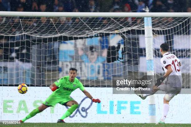 Alessio Romagnoli of Milan scoring the decisive penalty against goalkeeper Thomas Strakosha of Lazio at Olimpico Stadium in Rome, Italy on February...