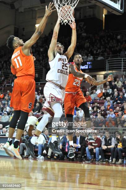 Boston College Eagles guard Jordan Chatman splits the defenders and goes up for the basket. During the Boston College Eagles game against the...