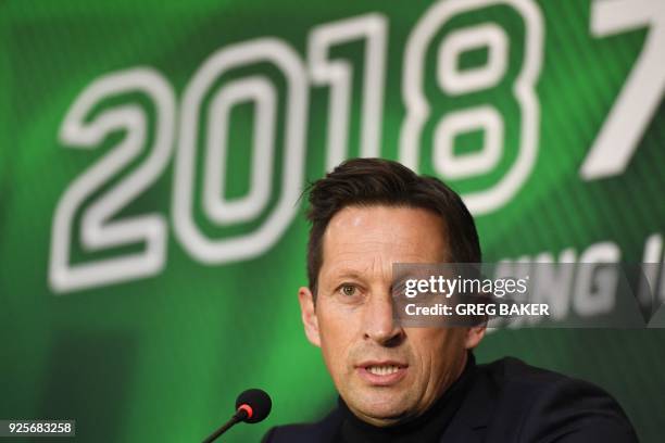 Beijing Guoan's coach Roger Schmidt speaks during a press conference to introduce the team's new football players in Beijing on March 1, 2018. -...