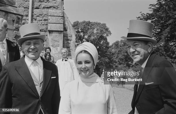 British actors Richard Burton , Elizabeth Taylor and Noel Coward attend the wedding of Sheran Cazalet and Simon Horby, UK, 15th June 1968.
