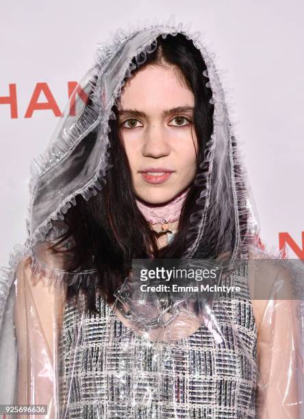 Grimes, wearing Chanel, attends a Chanel Party to celebrate the Chanel Beauty House and @WELOVECOCO at Chanel Beauty House on February 28, 2018 in...