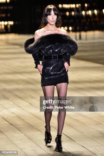 Jamie Bochert walks the runway during the Saint Laurent show as part of the Paris Fashion Week Womenswear Fall/Winter 2018/2019 on February 27, 2018...