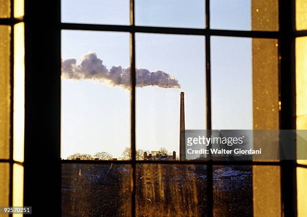 factory outside of a window - giordani walter stockfoto's en -beelden