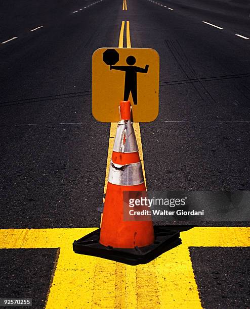 warning sign on a cone - giordani walter stockfoto's en -beelden