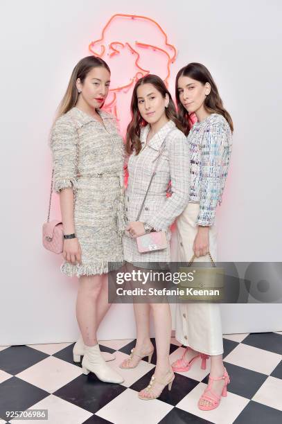 Este Haim, Alana Haim aand Danielle Haim of HAIM , all wearing Chanel, attend a Chanel Party to celebrate the Chanel Beauty House and @WELOVECOCO at...