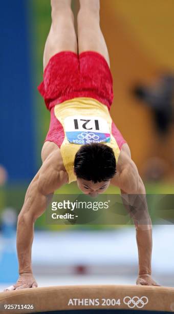 China's Li Xiaopeng performs during the men's vault final 23 August 2004 at the Olympic Indoor Hall in Athens during the Olympics Games. AFP PHOTO /...