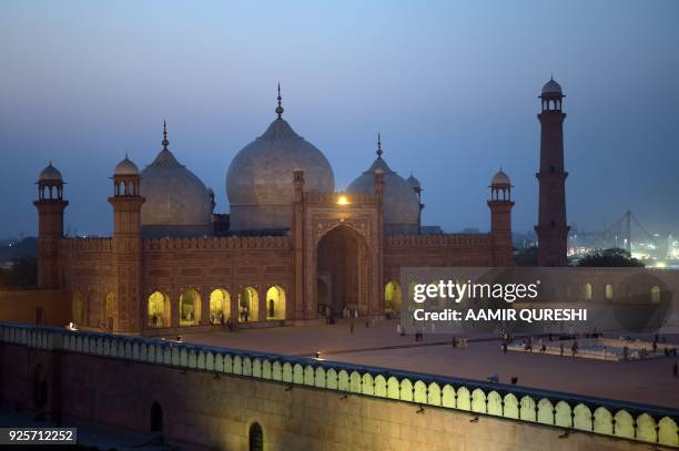 In this photograph taken on October 6 tourists visit the historic Badshahi Mosque in Lahore. Lahore, which once served as the capital of the Mughal...