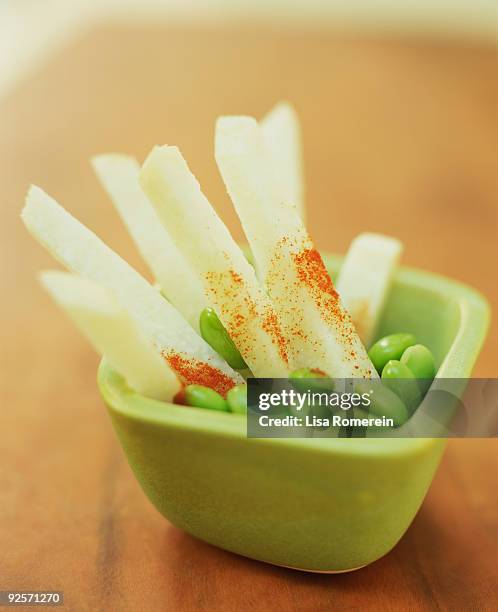 jicama with chile powder - jicama stock-fotos und bilder