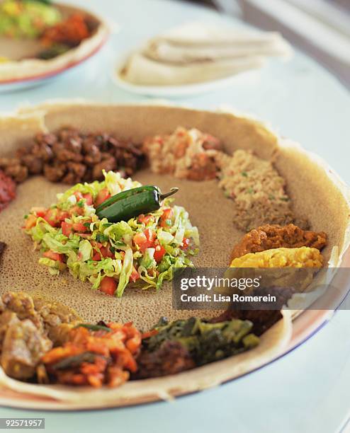 ethiopian vegetarian platter with injera - ethiopian food stock pictures, royalty-free photos & images