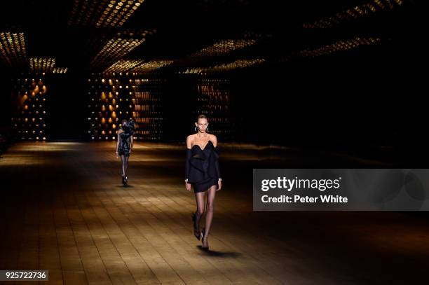 Binx Walton walks the runway during the Saint Laurent show as part of the Paris Fashion Week Womenswear Fall/Winter 2018/2019 on February 27, 2018 in...