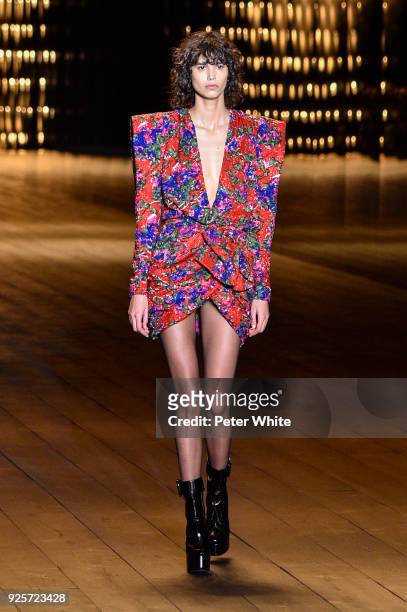 Mica Arganaraz walks the runway during the Saint Laurent show as part of the Paris Fashion Week Womenswear Fall/Winter 2018/2019 on February 27, 2018...