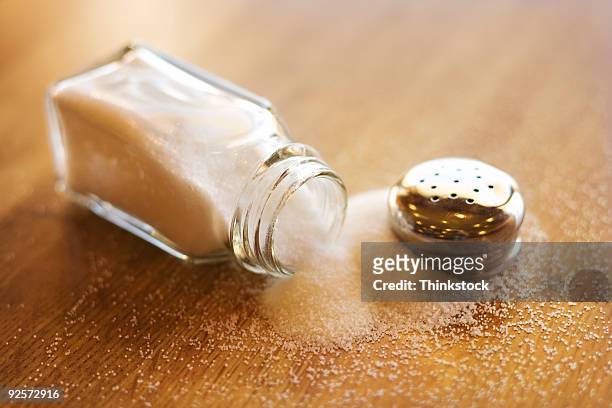 spilled salt shaker - salt shaker ストックフォトと画像