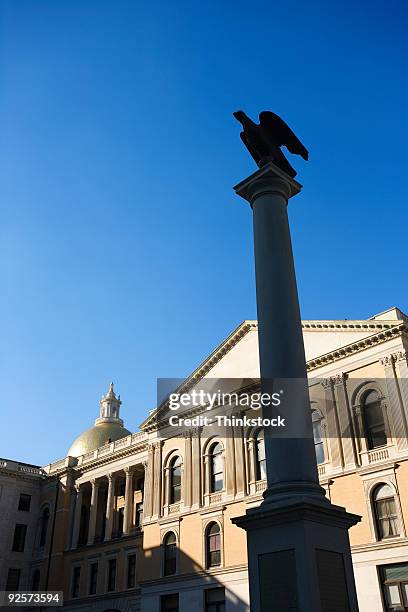 column in front of building in downtown boston - thinkstock 個照片及圖片檔