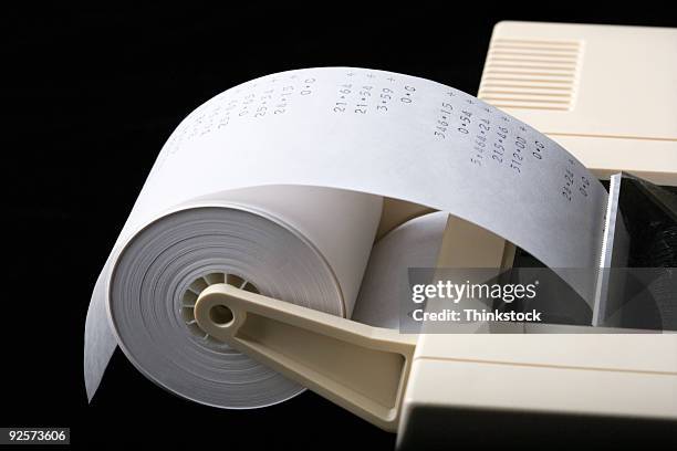 adding machine with tape - thinkstock 個照片及圖片檔