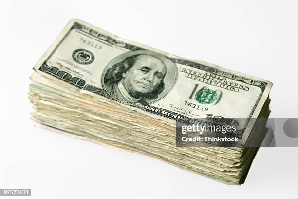 stack of hundred dollar bills - thinkstock 個照片及圖片檔