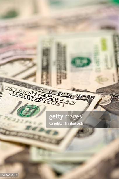 various denominations of u.s. paper currency - thinkstock fotografías e imágenes de stock