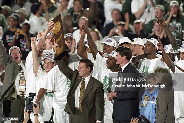 Final Four: Michigan State coach Tom Izzo victorious with team and NCAA National Championship trophy after winning game vs Florida. Indianapolis, IN...