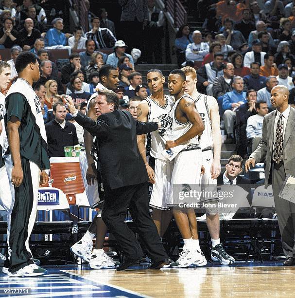 Big Ten Tournament: Michigan State coach Tom Izzo pulling Morris Peterson and teammates on sidelines during 2nd half of game vs Illinois. Chicago, IL...