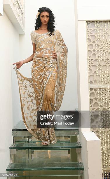 Model Lakshmi Rana showcases an outfit at a multi-designer store, Ahamm, in New Delhi's Khan market on October 22, 2009.