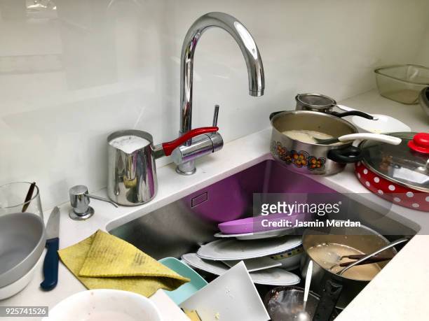 messy sink full of dishes - dirty sink stock pictures, royalty-free photos & images