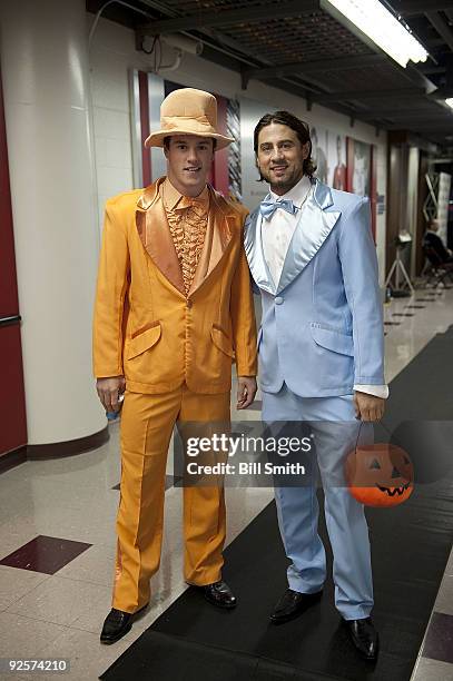 Jonathan Toews and Adam Burish of the Chicago Blackhawks dress up for Halloween before the game against the Montreal Canadiens on October 30, 2009 at...