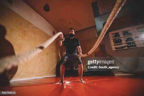 hard battle ropes training - battle rope stock pictures, royalty-free photos & images