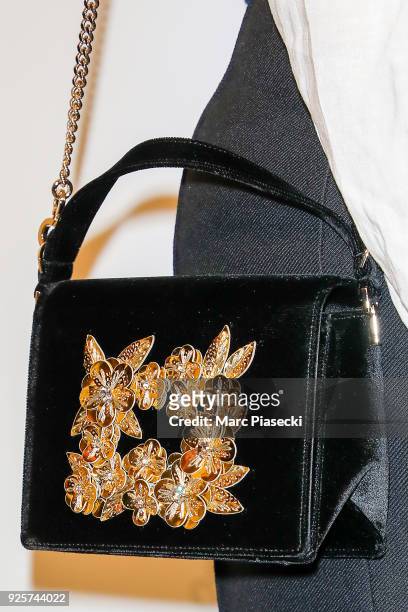 Actress Alysson Paradis, handbag detail, attends the H&M show as part of the Paris Fashion Week Womenswear Fall/Winter 2018/2019 on February 28, 2018...