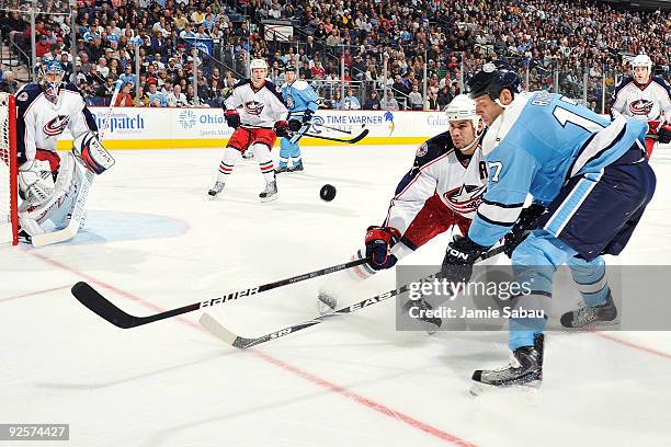 Rostislav Klesla of the Columbus Blue Jackets attempts to block a shot from Michael Rupp of the Pittsburgh Penguins during the second period on...