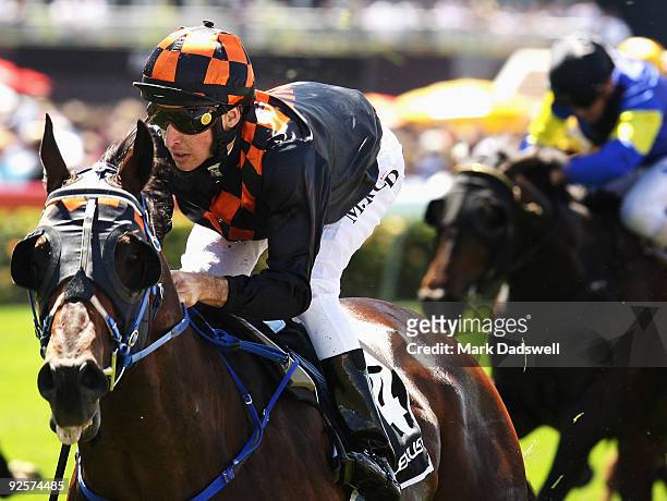 Jockey Michael Rodd riding Shocking wins the Lexus Stakes during the 2009 Victoria Derby Day meeting at Flemington Racecourse on October 31, 2009 in...