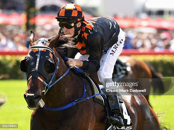 Jockey Michael Rodd riding Shocking wins the Lexus Stakes during the 2009 Victoria Derby Day meeting at Flemington Racecourse on October 31, 2009 in...