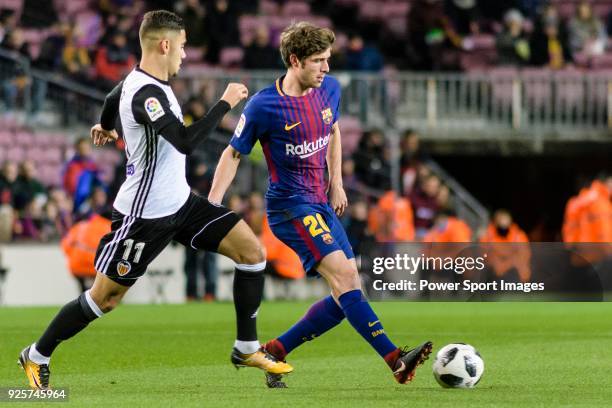 Sergi Roberto Carnicer of FC Barcelona in action against Andreas Pereira of Valencia CF during the Copa Del Rey 2017-18 match between FC Barcelona...