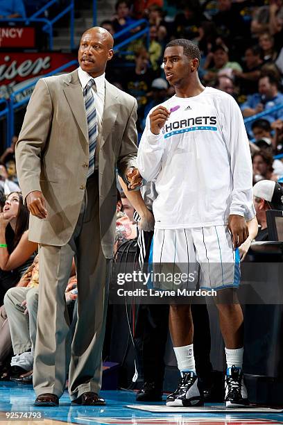 Head coach Byron Scott of the New Orleans Hornets speaks with Chris Paul during the Hornets' game against the Sacramento Kings on October 30, 2009 at...