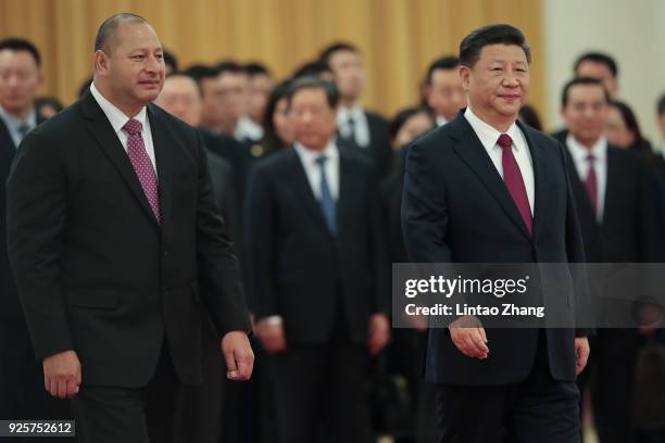 Chinese President Xi Jinping accompanies King Tupou VI to view an honour guard during a welcoming ceremony inside the Great Hall of the People on...