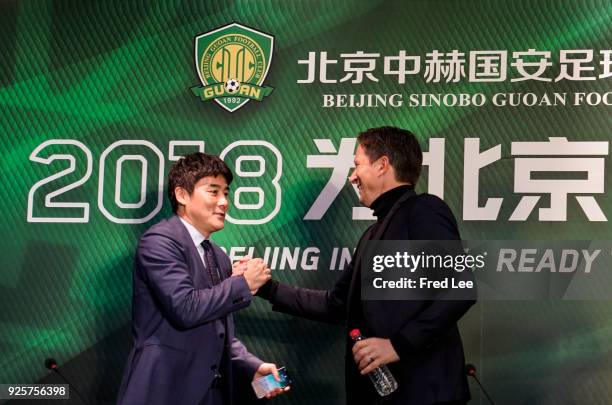 Li Ming , General Manager of Beijing Sinobo Guoan FC and Head coach of Beijing Guoan Roger Schmidt attend a press conference at Worker's Stadium on...